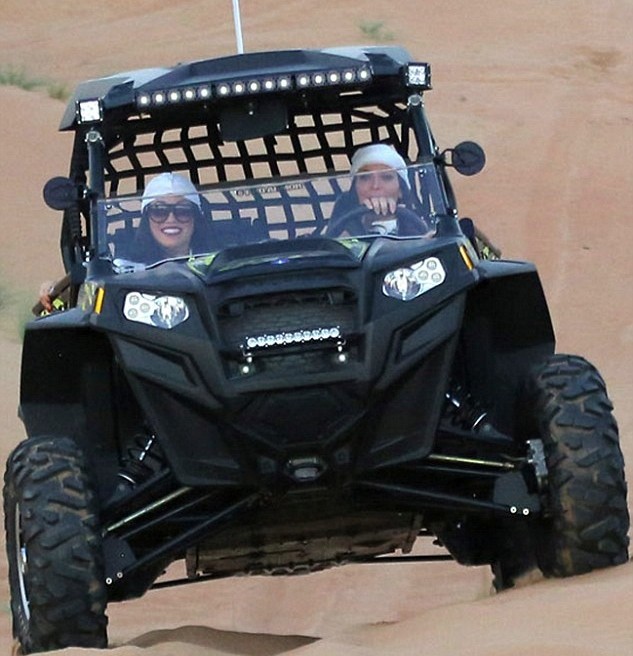 http://s1.cdn.autoevolution.com/images/news/gallery/kim-kardashian-rode-a-buggy-in-dubais-dunes-wore-white-of-course-photo-gallery_1.jpg