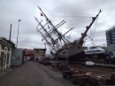 Bark Europa, a 1911 vessel converted into a three-masted sailing ship, has toppled over in dry dock during maintenance work