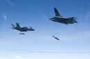 F-35 Lightning and F-16 Fighting Falcon dropping bombs