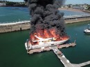 Superyacht catches fire and sinks at Torquay Harbor in England