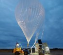 SuperBIT telescope next to the helium-filled balloon which will carry it into the stratosphere