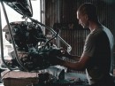 Car Mechanic Replacing an Engine