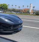 A woman in a Ferrari has bad luck at a traffic light, the car takes her slightly downhill