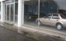 Abandoned Ford dealership, full of cars from the 1980s and 1990s