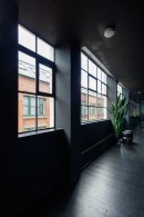 Former Victorian Mill warehouse hides Batman-inspired apartment painted fully in black