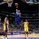 Allen Iverson attempts a dunk with Kobe Bryant and Shaquille O'Neal watching