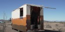 Box truck was converted into a mobile workshop that doubles as a tiny home