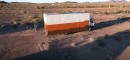 Box truck was converted into a mobile workshop that doubles as a tiny home