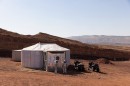 analog astronauts in their Aouda space suit simulators are seen in front of the crew’s Mars habitat in the Ramon Crater in Israel
