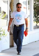 Arnold Schwarzenegger Drives His Green Hummer H1