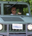 Arnold Schwarzenegger Drives His Green Hummer H1