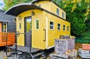 Arthur is a tiny house inspired by a caboose car, offering sleeping for four people