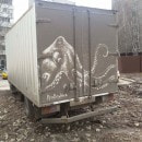 Street artist draws on dirty cars