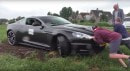 Aston Martin DBS stuck in mud