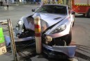 Woman crashes V12 Aston Martin Vanquish in Melbourne, Australia, flees and leaves owner inside the wreck