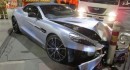 Woman crashes V12 Aston Martin Vanquish in Melbourne, Australia, flees and leaves owner inside the wreck