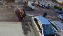 Audi Driver Crashes into Flatbed Truck, Flips Over Twice