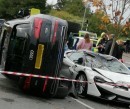 Audi Q5 ends up on the side after mounting McLaren 570GT Coupe in parking lot