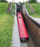 Three-barge bachelor party ends predictably bad, with one narrowboat underwater, stuck at a lock