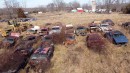 Mopar muscle cars on a farm field