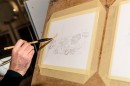 Adrian Mitu draws BMWs using coffee and watercolors