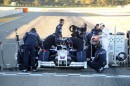 BMW Sauber mechanics prepare the car for its first test-drive