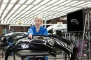 BMW Worker checking bumper for flaws