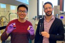 Chengshuang Zhou holds vials of ruthenium, left, and the coated catalyst, while Matteo Cargnello holds the pipe used for the reaction experiments.