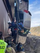 Couple crashes Ford F-350 and trucks dangles from a bridge in Idaho