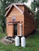 Tiny home on wheels with dual lofts