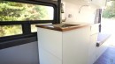 Off-Grid Camper Van Conversion Breaks the Mould With a Cozy "Burrito Bed"