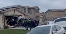 Car goes airborne and into the garage door of a home