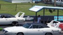 Cloned old school 1970 Plymouth Superbird twins drag race each other on Shift