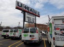 Cops stop U-Haul truck with a car hanging out the back