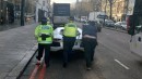 Cops and civilian push 2012 Lamborghini Aventador after breaking down in London, UK