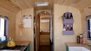 Cute and Cozy School Bus Conversion Serves as a Full-Time Home for a Couple and Their Baby