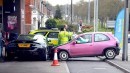 Pink Corsa Crashes into Aston Martin DBS