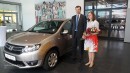 Diana Ileana Şerban, the 1.5 millionth Logan buyer and Jan Ptacek, Renault Commercial Roumanie General Manager