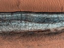 Cut on Martian surface reveals subsurface ice