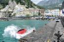 Fiat 500s being thrown into the sea