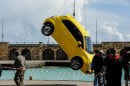 Fiat 500s being thrown into the sea
