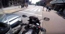 Distracted driver hits stopped motorcycle