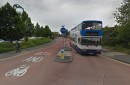 Road signs warning drivers they're not allowed to turn left on the bus-only lane