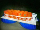 Students make raft out of kiddie pools, plastic buckets and plywood, drift out into the Pacific on it