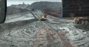 Dump truck drifting on mud