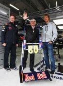 Horner, Vettel and Ecclestone pose in front of the media