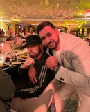 Rapper Eminem and retired boxer Amir Khan pose for a photo at boxing event