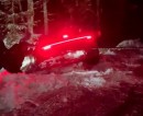 Porsche 911 stuck in a ditch after an alleged drift attempt on snow