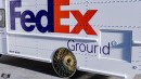 FedEx and UPS Freightliner delivery vans on gold Dayton wire wheels rendering