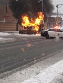 Snow plow engulfed in flames, just feet away from fire station